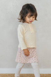 Toddler wearing Avauma Lovely Breeze Henley Shirt in Sugar Cream – Soft and breathable babywear
